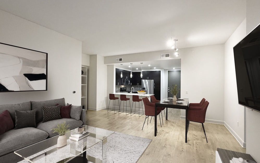 living room with a coffee table and couch and dining area with a table and chairs