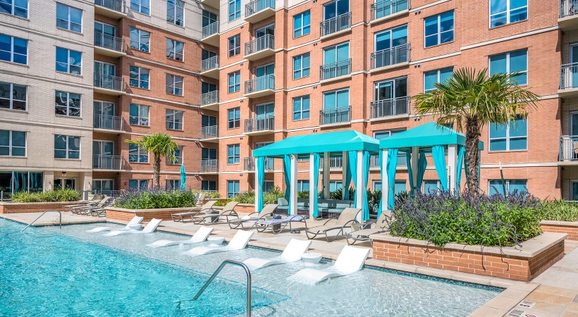 Resort-style swimming pool with lounge seating